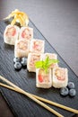 Sweet sushi rolls, strawberries, banana, chocolate Royalty Free Stock Photo