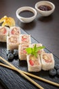 Sweet sushi rolls, strawberries, banana, chocolate Royalty Free Stock Photo