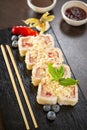 Sweet sushi rolls, strawberries, banana, chocolate Royalty Free Stock Photo