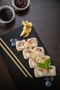 Sweet sushi rolls, strawberries, banana, chocolate Royalty Free Stock Photo