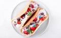 Sweet tacos with thin waffle, cottage cheese cream and strawberry Royalty Free Stock Photo