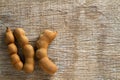 Sweet tamarinds on wooden background.