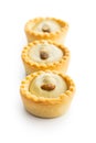 Sweet tarlets. Tasty mini tarts. Mini pie with cream isolated on white background