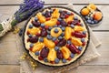 Sweet tart with peaches, plums and blueberries Royalty Free Stock Photo