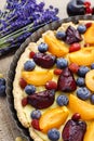 Sweet tart with peaches, plums and blueberries Royalty Free Stock Photo