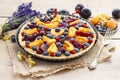 Sweet tart with peaches, plums and blueberries Royalty Free Stock Photo