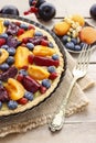 Sweet tart with peaches, plums and blueberries Royalty Free Stock Photo