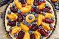 Sweet tart with peaches, plums and blueberries Royalty Free Stock Photo