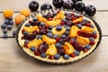 Sweet tart with peaches, plums and blueberries Royalty Free Stock Photo