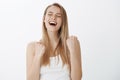 Sweet taste of success. Happy delighted and relived young woman screaming yes from victory and pleasure receiving award Royalty Free Stock Photo