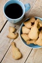 Sweet tasty cookies in the blue plate and cup of black coffee Royalty Free Stock Photo
