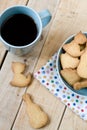 Sweet tasty cookies in the blue plate and cup of black coffee Royalty Free Stock Photo