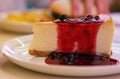 Sweet and tasty - fresh cheescake with red berry jam