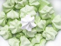 sweet and tasty mint green and white merengues, French dessert Meringue prepared from whipped with sugar and baked eggs.