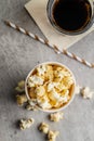 Sweet tasty popcorn in cup and glass of cola