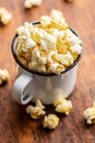 Sweet tasty popcorn in mug