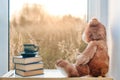 Sweet Teddy bear with cup of coffee. At a morning sun light. Good morning concept