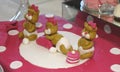 Sweet teddy bears on a pink birthday cake