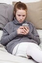 A sweet teenage girl in headphones listening to music Royalty Free Stock Photo