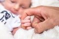 sweet tiny new born baby hand hold mum index finger. concept relationship between mother or parants and baby Royalty Free Stock Photo