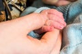 sweet tiny new born baby hand hold mum index finger. concept relationship between mother or parants and baby Royalty Free Stock Photo