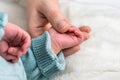 sweet tiny new born baby hand hold mum index finger. concept relationship between mother or parants and baby Royalty Free Stock Photo