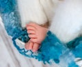 Sweet tiny newborn feet on fluffy blanket Royalty Free Stock Photo