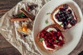 Sweet toast with berry jam at parchment background