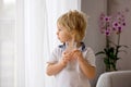 Sweet toddler boy, drinking water at home Royalty Free Stock Photo