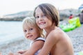 Sweet toddler child, eating pizza on the beach, having fun, smiling happily, kid enjoying dinner Royalty Free Stock Photo