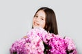 Sweet toddler girl with floral on and flowers bunch in hands. Child. Childhood. Kids. Portrait of a smiling little girl Royalty Free Stock Photo