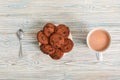 Sweet treat. cookies on plate and cup of cocoa on table top view close-up