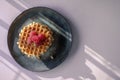 Sweet Viennese waffles with fresh ripe raspberries are served for Breakfast on a beautiful plate. top view. Copy space Royalty Free Stock Photo