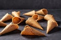 Sweet waffle cones for ice cream  on black background, horizontal composition Royalty Free Stock Photo