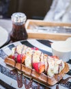 Sweet Waffles with strawberry, Ice Cream, chocolate and Syrup ba Royalty Free Stock Photo