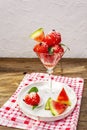 Sweet watermelon ice cream with coconut flakes and fresh basil leaves Royalty Free Stock Photo