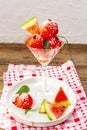 Sweet watermelon ice cream with coconut flakes and fresh basil leaves Royalty Free Stock Photo