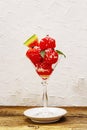 Sweet watermelon ice cream with coconut flakes and fresh basil leaves Royalty Free Stock Photo