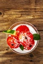 Sweet watermelon ice cream with coconut flakes and fresh basil leaves Royalty Free Stock Photo