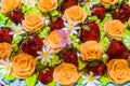 Sweet whipped cream orange roses, daisies and strawberry