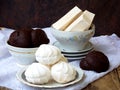 Sweet white Russian marshmallow, chocolate zephyr, meringue, apple pastila on wooden background. Royalty Free Stock Photo