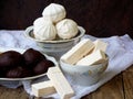 Sweet white Russian marshmallow, chocolate zephyr, meringue, apple pastila on wooden background. Royalty Free Stock Photo