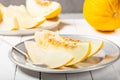 Sweet yellow fresh melon on wooden table Royalty Free Stock Photo