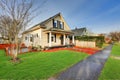 Sweet yellow Victorian home features original leaded glass windows