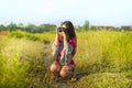 Sweet young Asian Chinese or Korean woman on her 20s taking picture with photo camera smiling happy in beautiful nature landscape Royalty Free Stock Photo