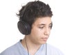 sweet young boy listening to music on headphones Royalty Free Stock Photo