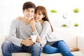 Sweet young couple sitting in sofa Royalty Free Stock Photo