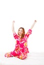 Sweet young girl in pink pajamas on bed Royalty Free Stock Photo