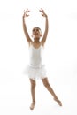 Sweet young little cute ballet dancer girl dancing on white background