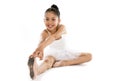 Sweet young little cute ballet dancer girl stretching on the floor